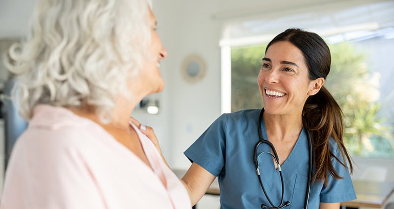 provider and patient laughing together