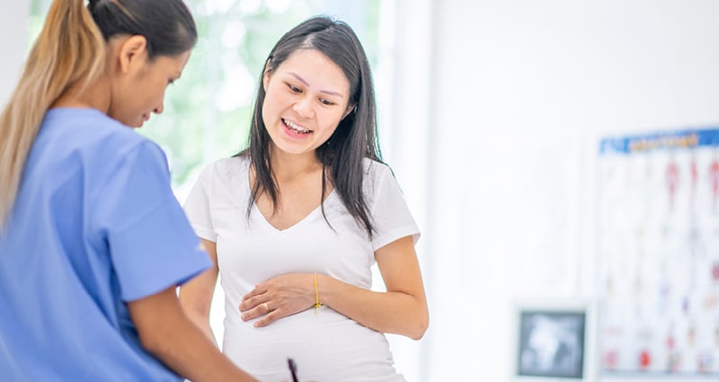 Expecting mom talking to provider