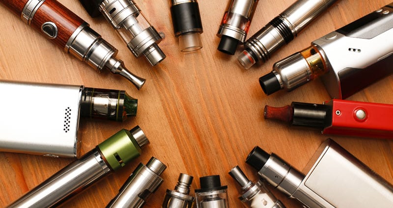 assorted vaping devices arranged in a circle