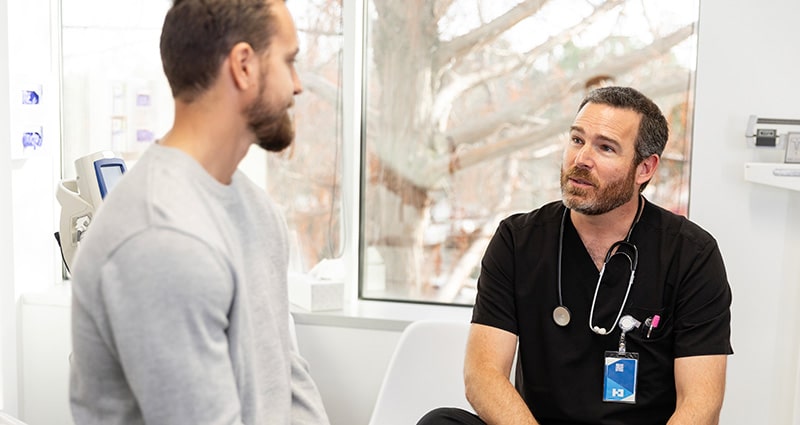 provider and patient talking in exam room