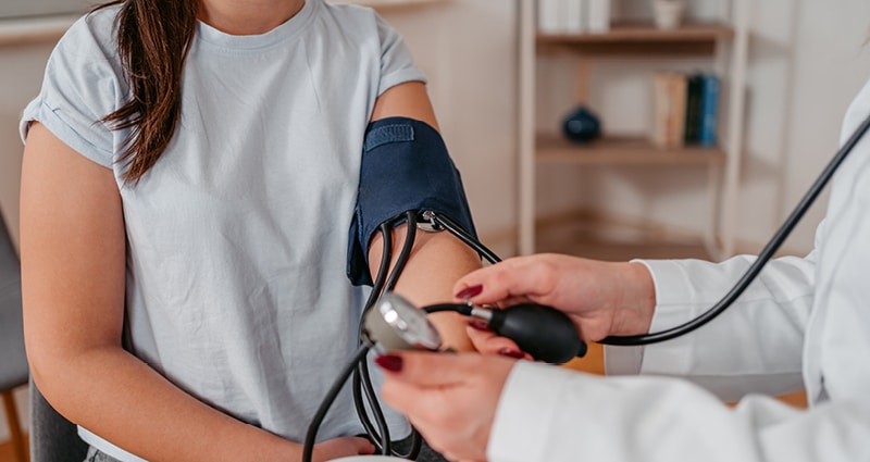 tween's blood pressure being checked