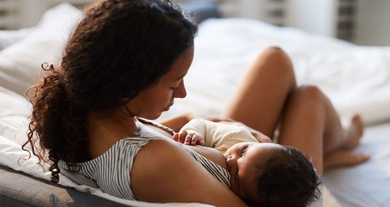 woman breastfeeding infant