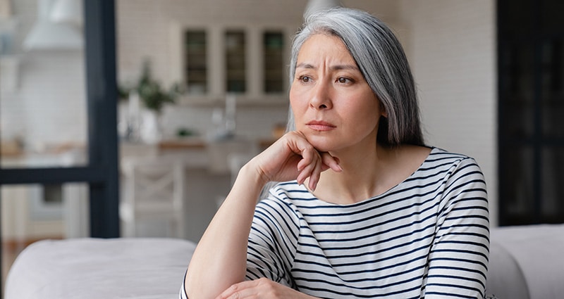 contemplative Asian woman