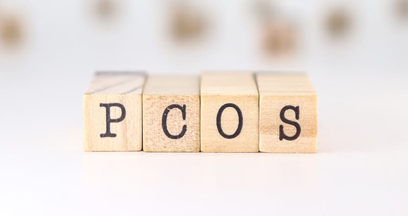 blocks in the letters PCOS