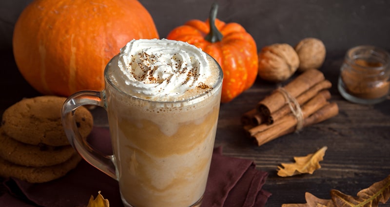 pumpkin spice drink with seasonal decor