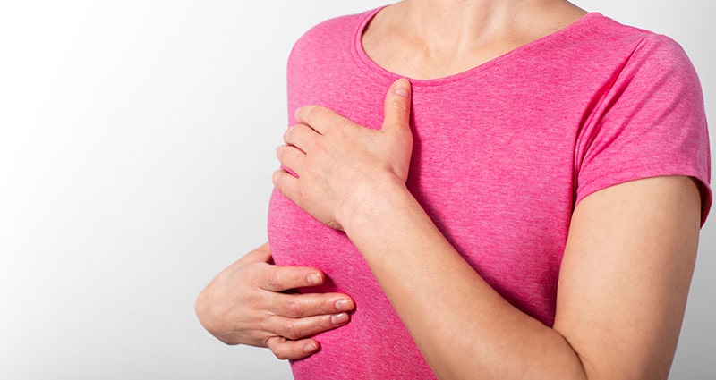 clothes woman examining her breast density