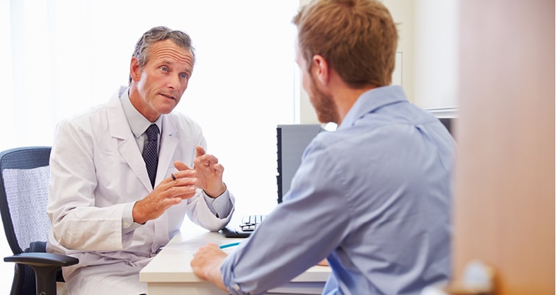 Doctor speaking with patient