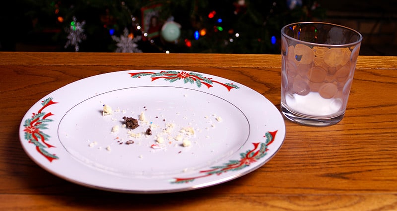 empty plate in front of Christmas tree