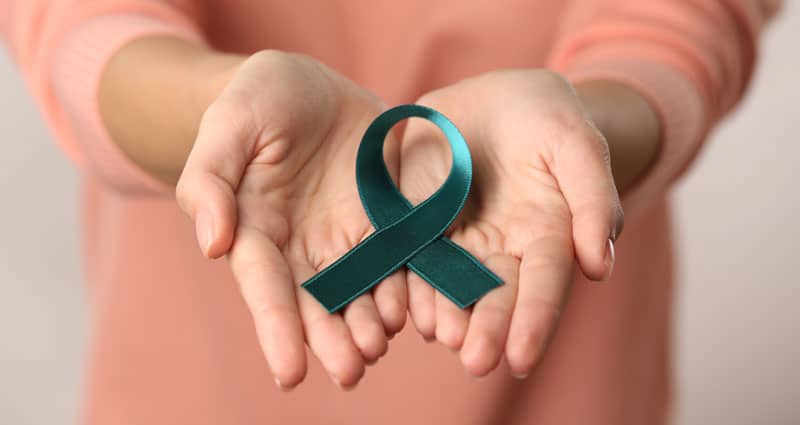 women holding cancer ribbon