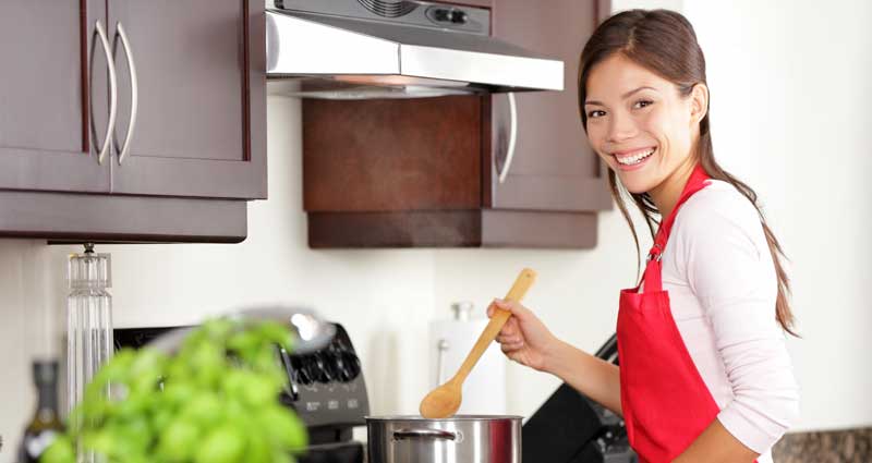 woman in kitchen cooking