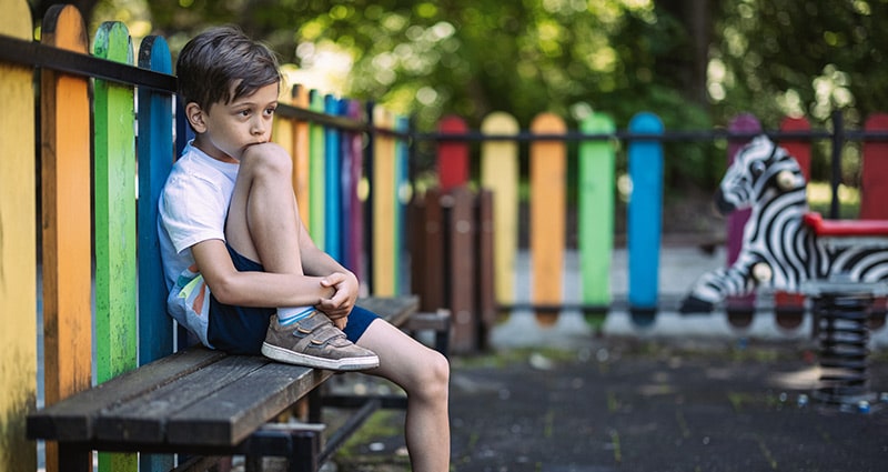 child sitting on a playground