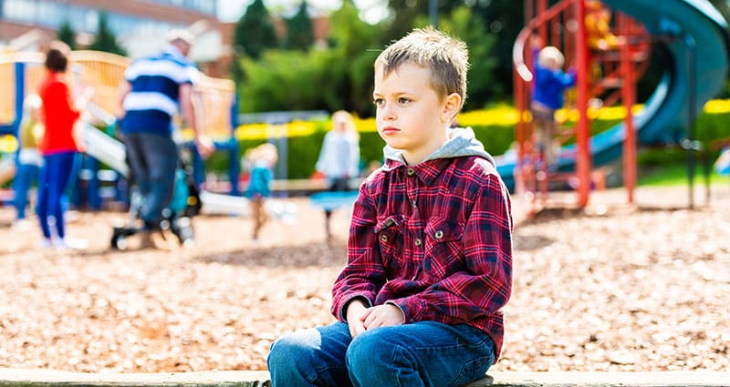 child sitting at playground