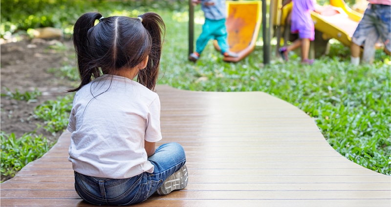 child watching others play