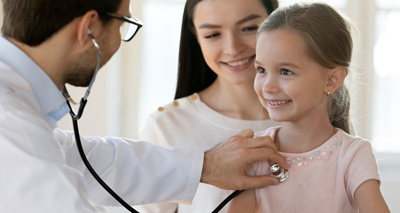 child having her heart listened to