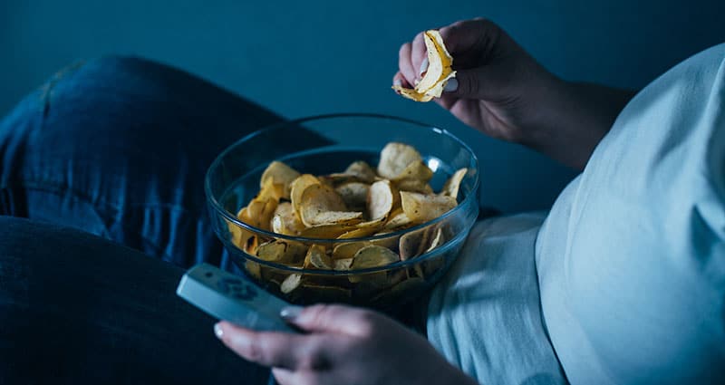 snacking in the glow of late night television