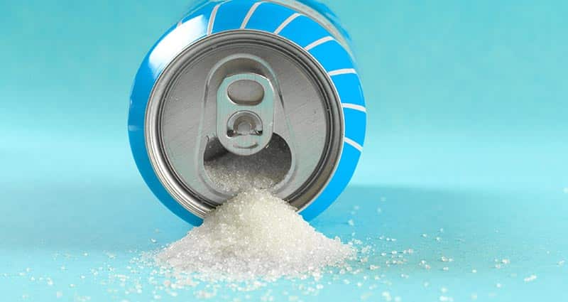 sugar pouring out of opened drink can