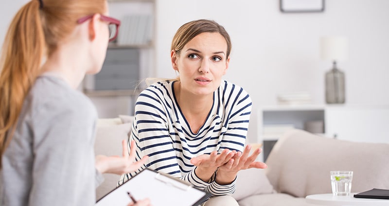 woman speaking to therapist