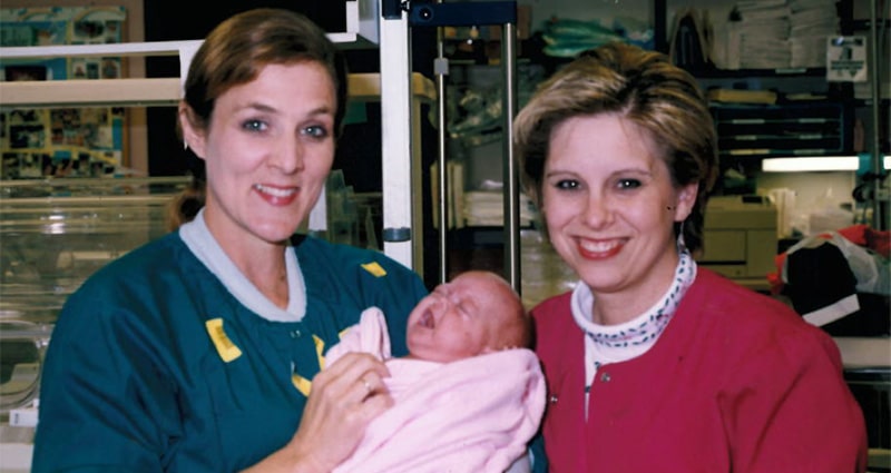 Hope with a nurse and her mom in the NICU