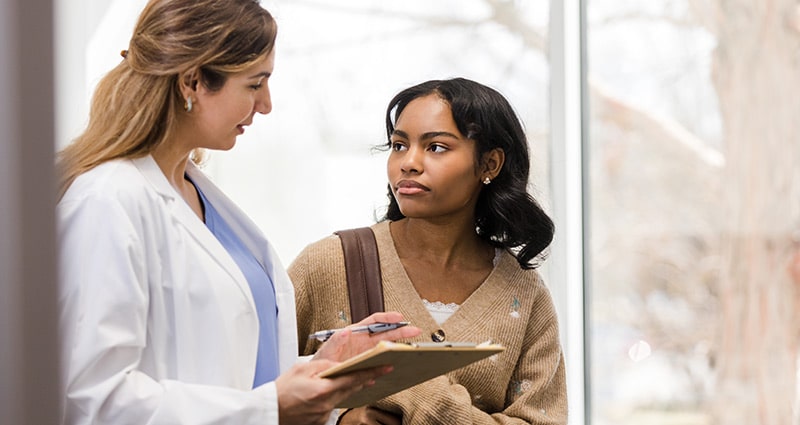 woman listening to her doctor