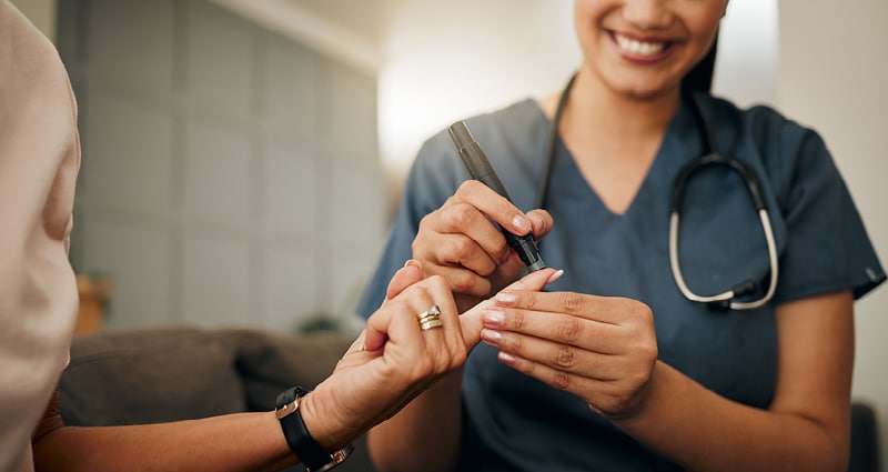 A healthcare provider takes a patient's blood sample.