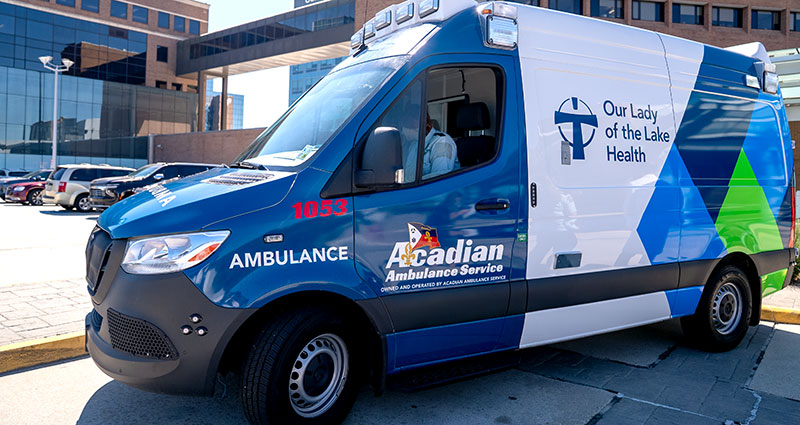 An Ambulance is parked outside a hospital entrance